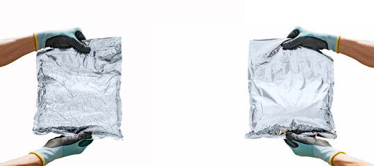 A worker is holding a packaging bag made of a material with foil