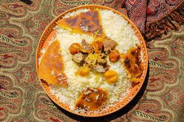 Traditional caucasian rice dish plov with dry fruits and meat