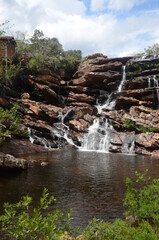 Fototapeta na wymiar Waterfall in Milho Verde in the state of Minas Gerais called Cachoeira do Moinho (translated to Watermill Waterfall)