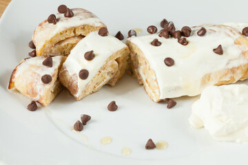 Tasty And Healthy Breakfast; Pancakes Rolled Up With Dietary Chocolate Chips And Honey.
