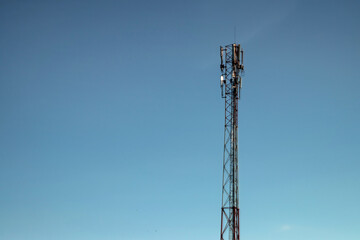 cell tower, silhouette against the blue sky. Communication concept, next generation networks.