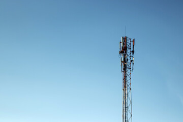 cell tower, silhouette against the blue sky. Communication concept, next generation networks.