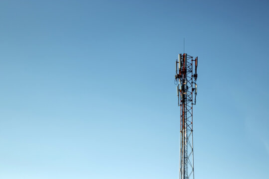 cell tower, silhouette against the blue sky. Communication concept, next generation networks.
