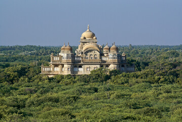 Fototapeta na wymiar The historic Vijaya Vilas Palace sits amidst tropical vegetation near Mandvi, Gujarat, India