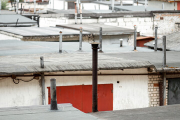 Naklejka premium pipes from the roofs of the garage, ventilation pipes.