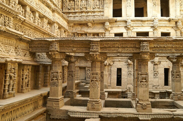 Ornately carved sandstone columns and walls of Rani-ki-Vav stepwell, Patan, Gujarat, India