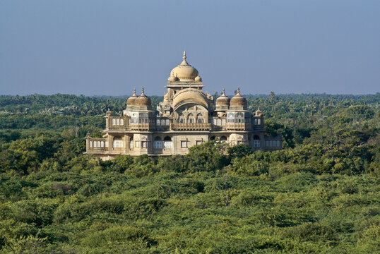 The historic Vijaya Vilas Palace sits amidst tropical vegetation near Mandvi, Gujarat, India