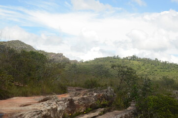 Hiking in the nature to the Waterfall in Milho Verde in the state of Minas Gerais called Cachoeira do Moinho (translated to Watermill Waterfall)