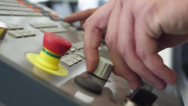 technician working with cnc control panel slow motion
