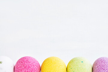 Colorful bath bombs on white background. Copy space for text