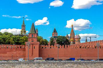 Obraz premium Kremlin embankment, towers of the Moscow Kremlin and domes of St. Basil's Cathedral