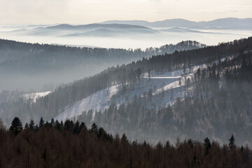 Foggy view of Beskid Sadecki mountain range in Poland