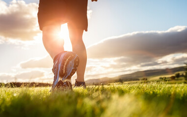 Running trail run in early sunrise