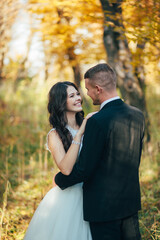 Fototapeta premium Bride and groom at a photo session in the nature
