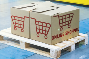 Online shopping logo. Products from the online store are packed in boxes. Boxes on wooden pallets. Concept - goods are ready to be sent to buyer. Online shopping inscription on boxes.