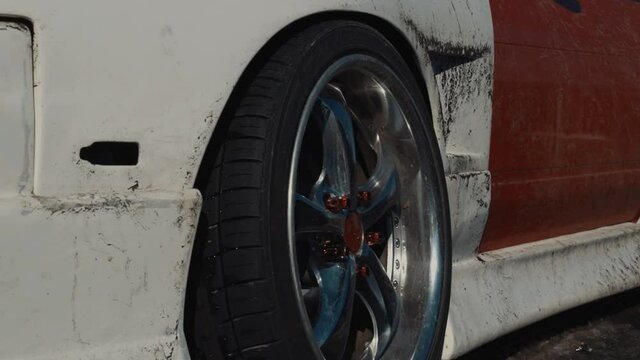 Close Up of a Modified Car Wheel after Drifting in the Snow.