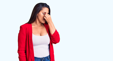Young beautiful brunette woman wearing elegant clothes tired rubbing nose and eyes feeling fatigue...