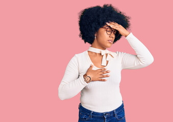 Young african american girl wearing casual clothes and glasses touching forehead for illness and fever, flu and cold, virus sick