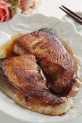 Japanese food, pan fried yellow tail Buri fish served soy sauce