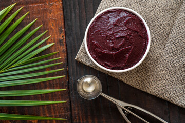 Acai bowl with fruit on table wooden
