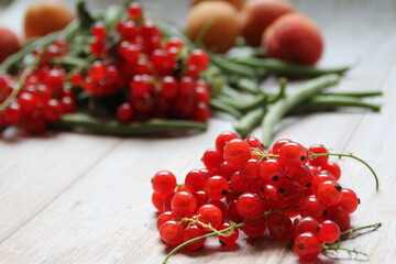 red currants on a wooden table