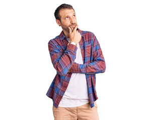 Young handsome man wearing casual clothes thinking worried about a question, concerned and nervous with hand on chin