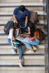 Top view of happy young Asian man and woman students show their books to their friends at university, Education back to university concept