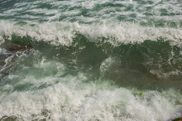 Waves during a storm. View from above. Red code. Rest on the Black Sea coast in Bulgaria. Elemental force.