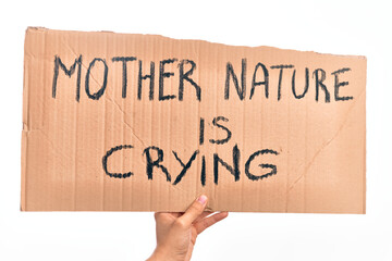 Cardboard banner with MOTHER NATURE IS CRYING text, protesting against climate change over isolated white background