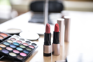 Cosmetics on a desk wood background, close up