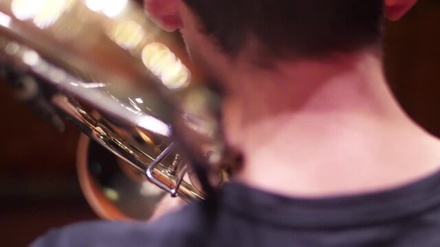 orchestra musician playing trombone slow motion	

