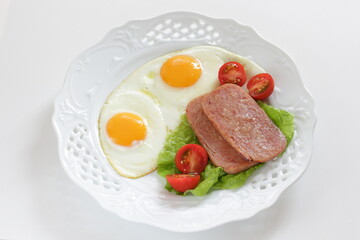 Luncheon meat and sunny side up fried egg for homemade breakfast
