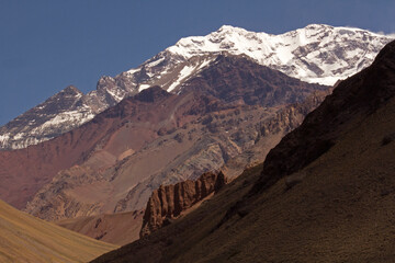 Mountaineering. View of the valley and snowy peak of mountain Aconcagua, highest peak in America.