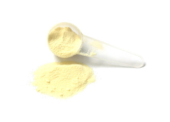 powdered milk and spoon for baby on white background