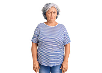 Senior woman with gray hair wearing casual striped clothes depressed and worry for distress, crying angry and afraid. sad expression.