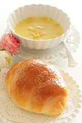 homemade butter roll on white dish with copy space