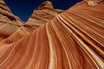 Fototapeta na wymiar Hiking the Wave in Utah and Arizona with a desert view of sandstone rock
