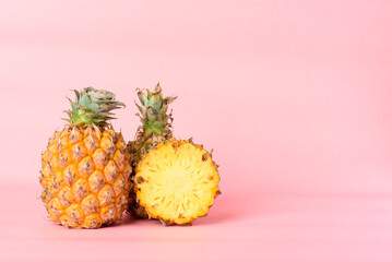 Fresh pineapple fruit on pastel pink background, Tropical fruit