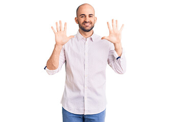 Naklejka premium Young handsome man wearing elegant shirt showing and pointing up with fingers number ten while smiling confident and happy.