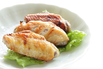 Homemade barbecue grilled chicken wing on lettuce with copy space