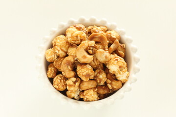 nut and caramel popcorn in bowl for snack food