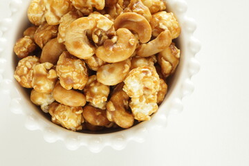 nut and caramel popcorn in bowl for snack food