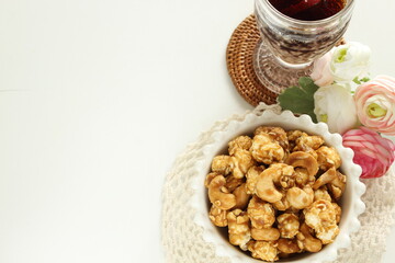 nut and caramel popcorn in bowl for snack food