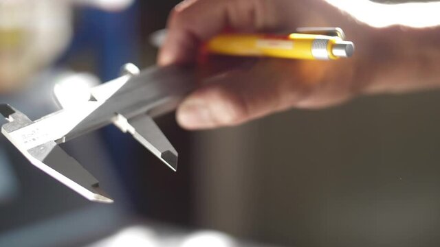 working with vernier caliper stainless steel measuring slow motion