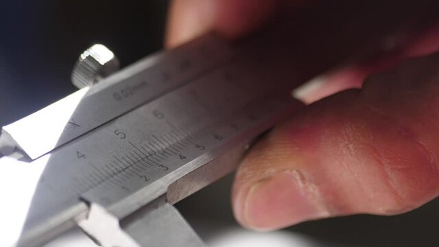 working with vernier caliper stainless steel measuring slow motion