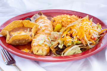 A view of a taco and enchilada plate.
