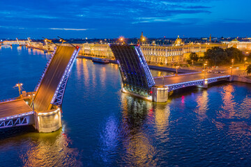 Saint Petersburg. Russia. The Palace bridge is divorced. Raising of the bridges. Bridges Of Petersburg. View from the Neva to the Hermitage. Winter palace in the evening. Panorama of the city.