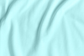 Texture and background of crumpled pastel turquoise fabric