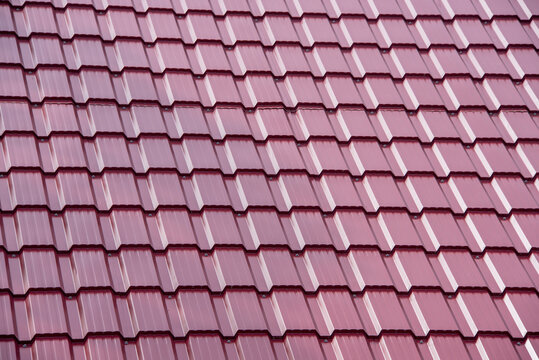 Close-up of red metal roof of a house