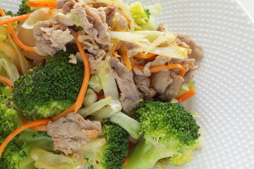 Chinese food,  pork and broccoli stir fried with carrot